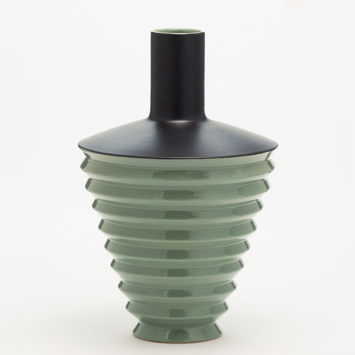 Handmade Green Ceramic Vase with the top part in matte black ceramic. The base is a glossy light green vase.